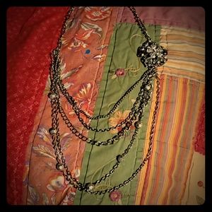 Silver toned multi strand statement necklace